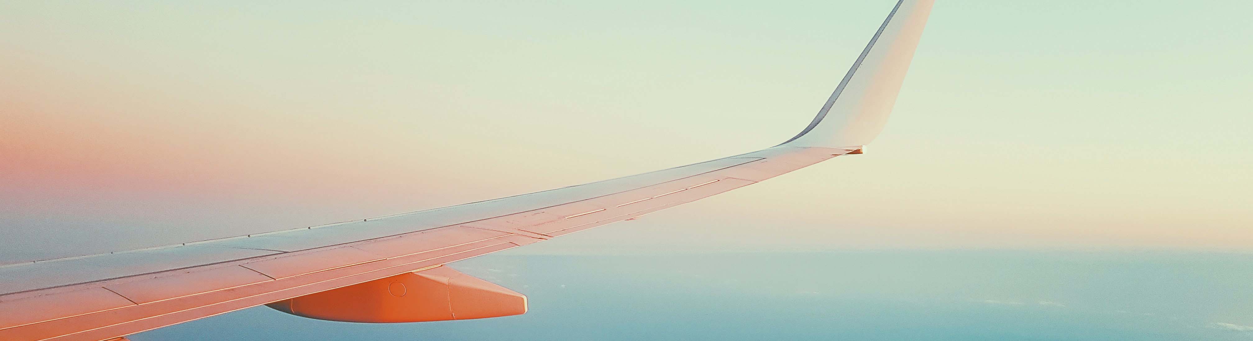 plane wing at sunset banner