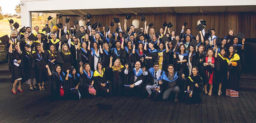 Graduation group shot on wooden deck