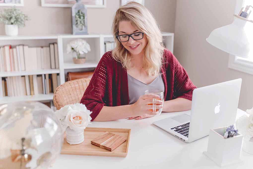 Women at desk working online